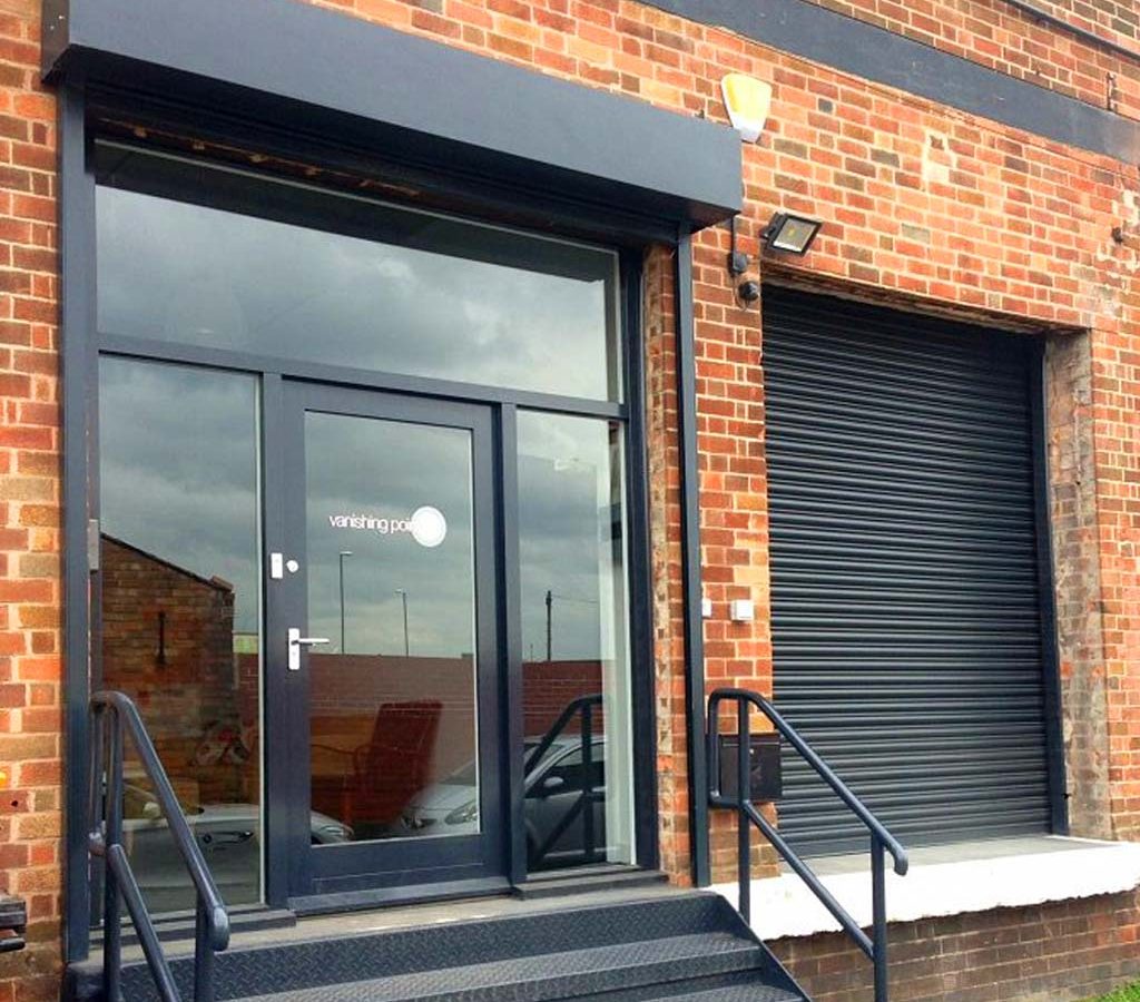 Heavy-gauge security roller shutter door with anti-lift bottom rail